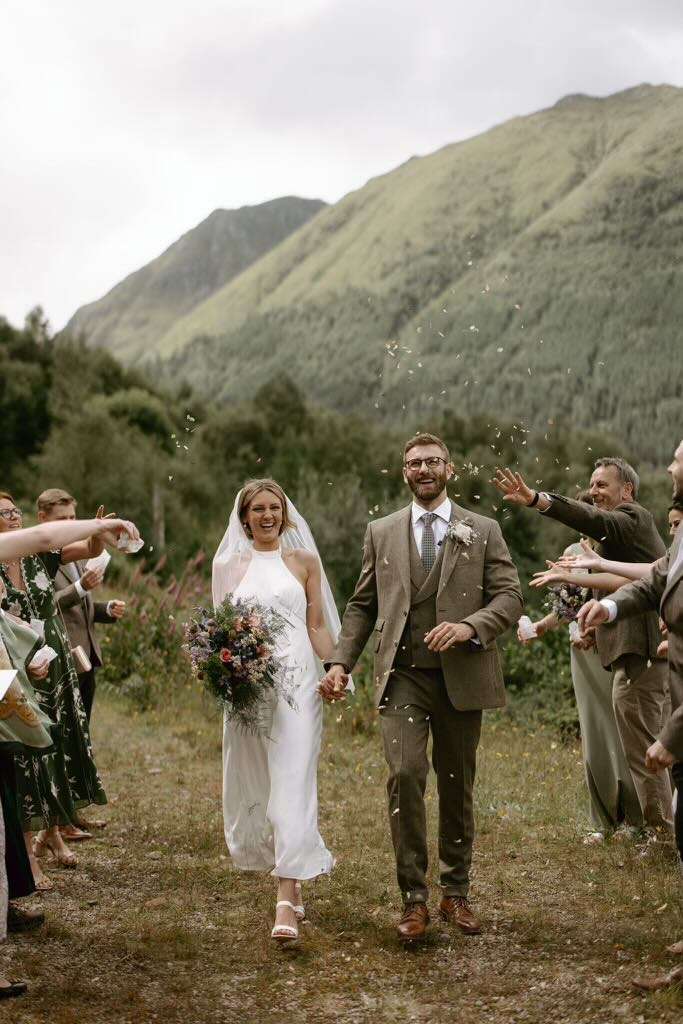 A couple get married in the hills behind the Woodlands Estate.