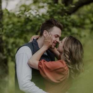 A couple share a kiss during a romantic walk in Glencoe.