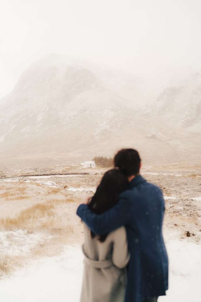 RiverBeds Luxury Wee Lodges with Hot Tubs book a Woodlands couples photoshoot. Photo taken in the winter of a romantic snow covered Glencoe.