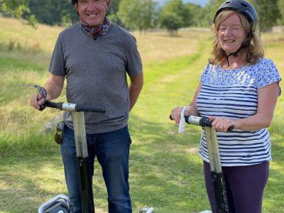 segway-fun-woodlands-glencoe-highlands-scotland-couple-2400×1600 Couple enjoying one of the best things to do in Glencoe with segway fun at Woodlands Glencoe Activity and Experience Centre