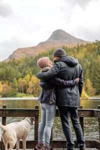 A couple with their dog at Glencoe Lochan