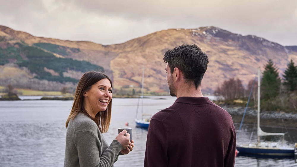 Couple enjoying coffee with spectacular mountain views