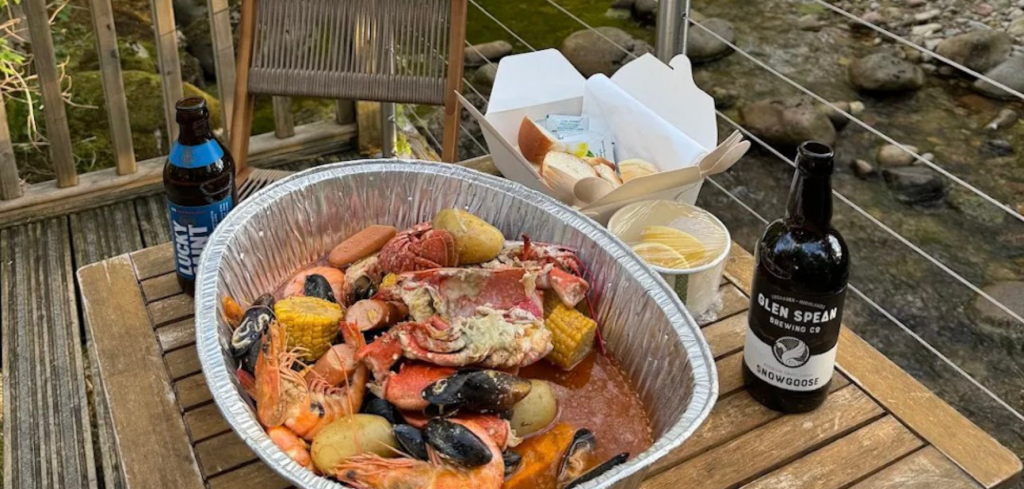 A seafood boil for two outside RiverBeds Luxury Wee Lodges at Woodlands Glencoe.