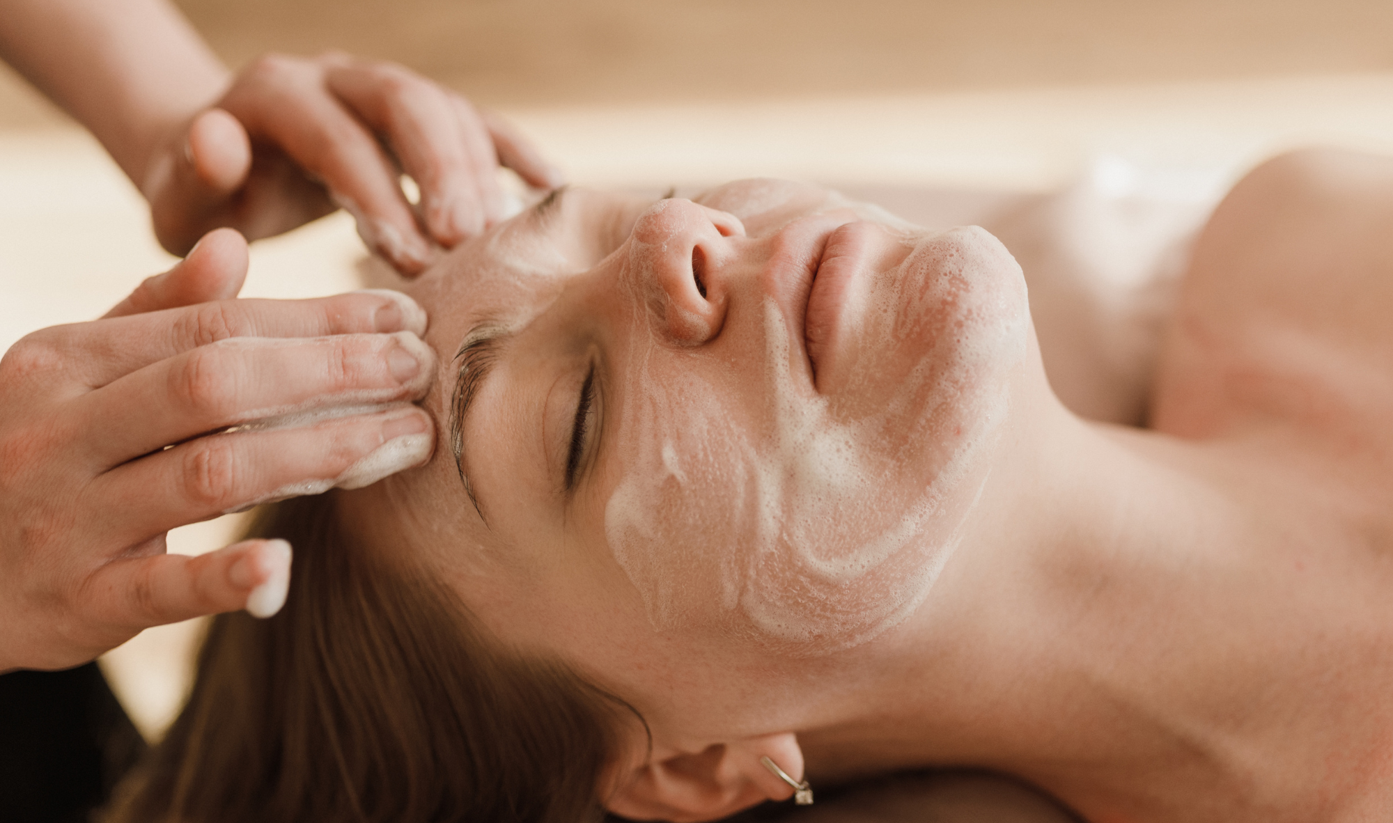 A lady enjoys a facial at Woodlands Wellness in Glencoe.