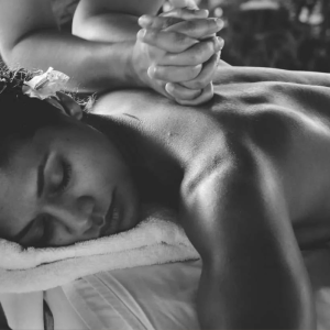 A lady enjoys a massage at Woodlands Wellness Studio in Glencoe.