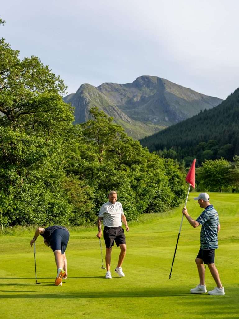 The perfect day in Glencoe if you're a golfer. Three men enjoy a round on Woodlands Golf Course.