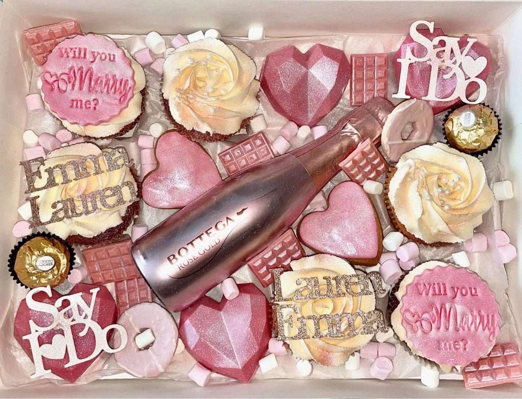 Lots of decorative cupcakes to celebrate a proposal at Woodlands Glencoe.