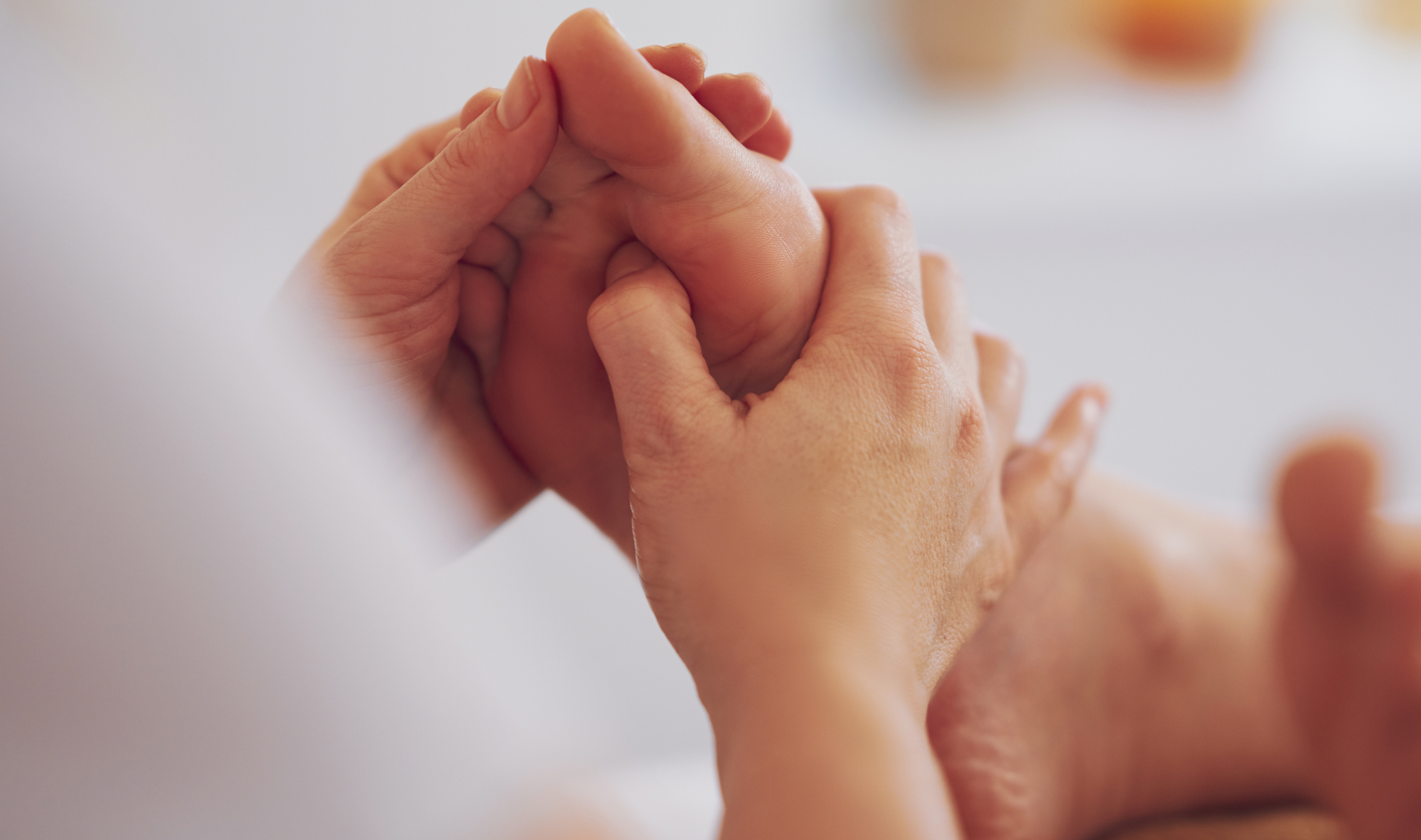 A lady enjoys reflexology and foot massage at Woodlands Wellness in Glencoe.