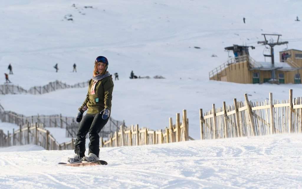 A snowboarder hits the slopes at Glencoe Mountain Resort near Woodlands.