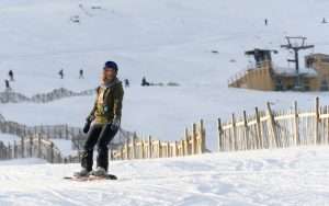 A snowboarder hits the slopes at Glencoe Mountain Resort near Woodlands.