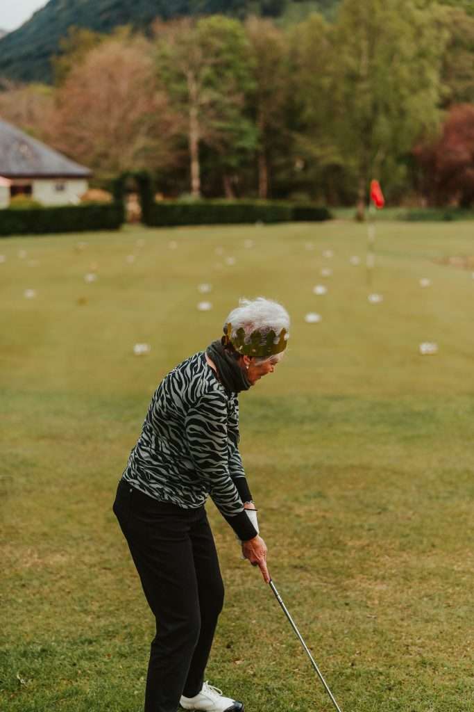 A woman plays a round of golf at Woodlands Glencoe.